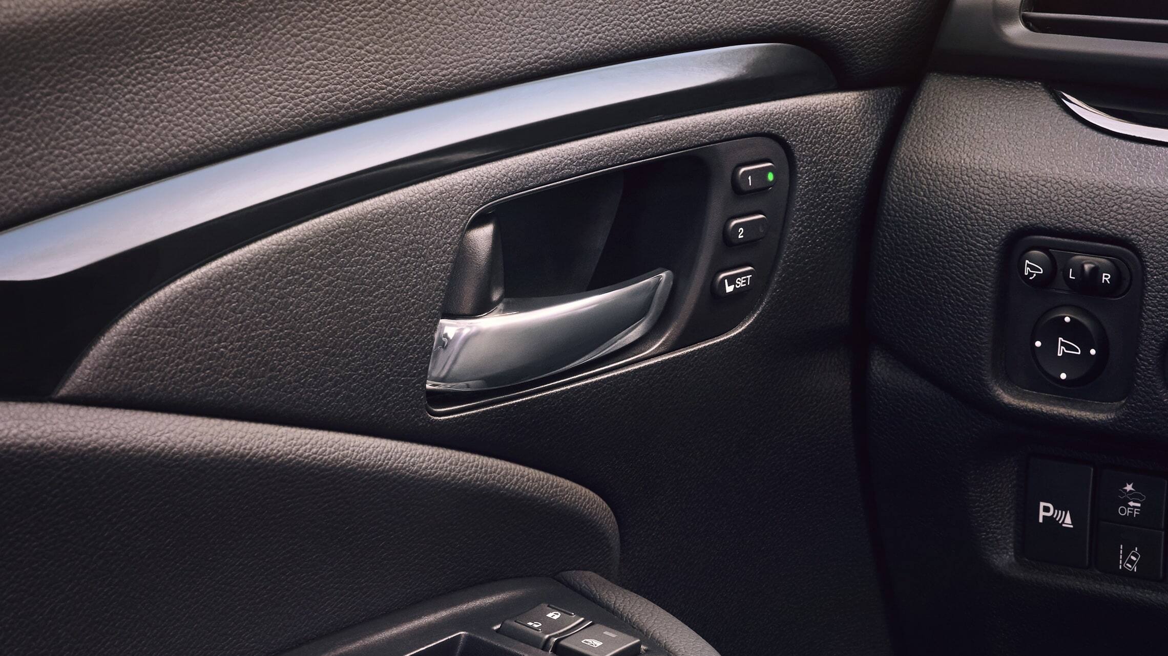 Driver’s seat memory setting detail on the 2019 Honda Passport Elite with Black Leather interior.
