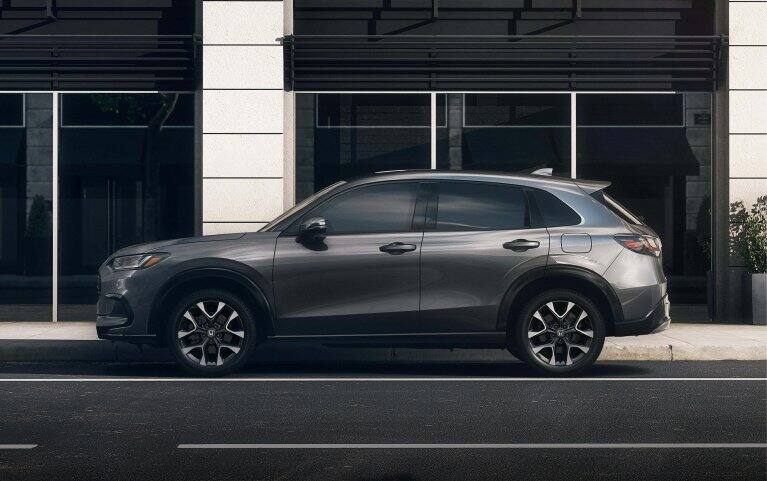 2028 Honda HR-V EX-L in Modern Steel Metallic profile view parked on a city street (Subcompact Crossover SUV).